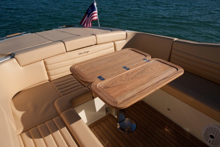 a boat sitting on top of a wooden chair