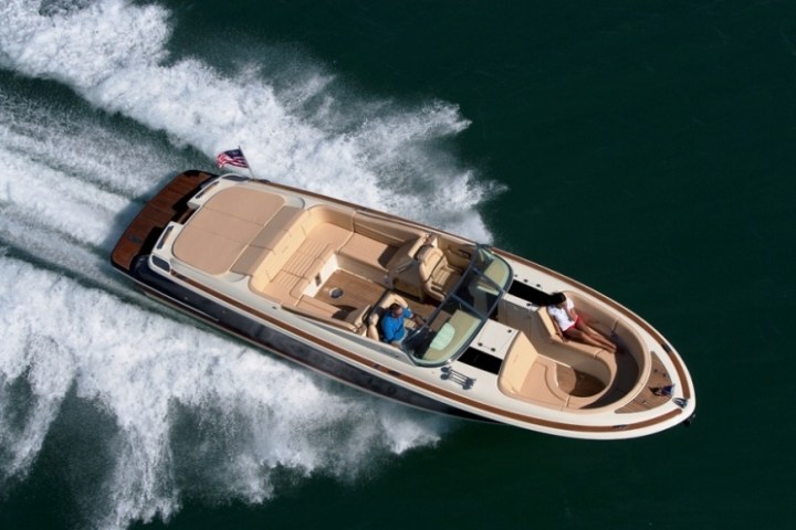 a person riding a wave on top of a boat