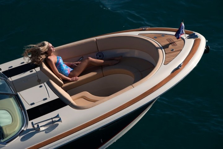 a person sitting on a boat in the water