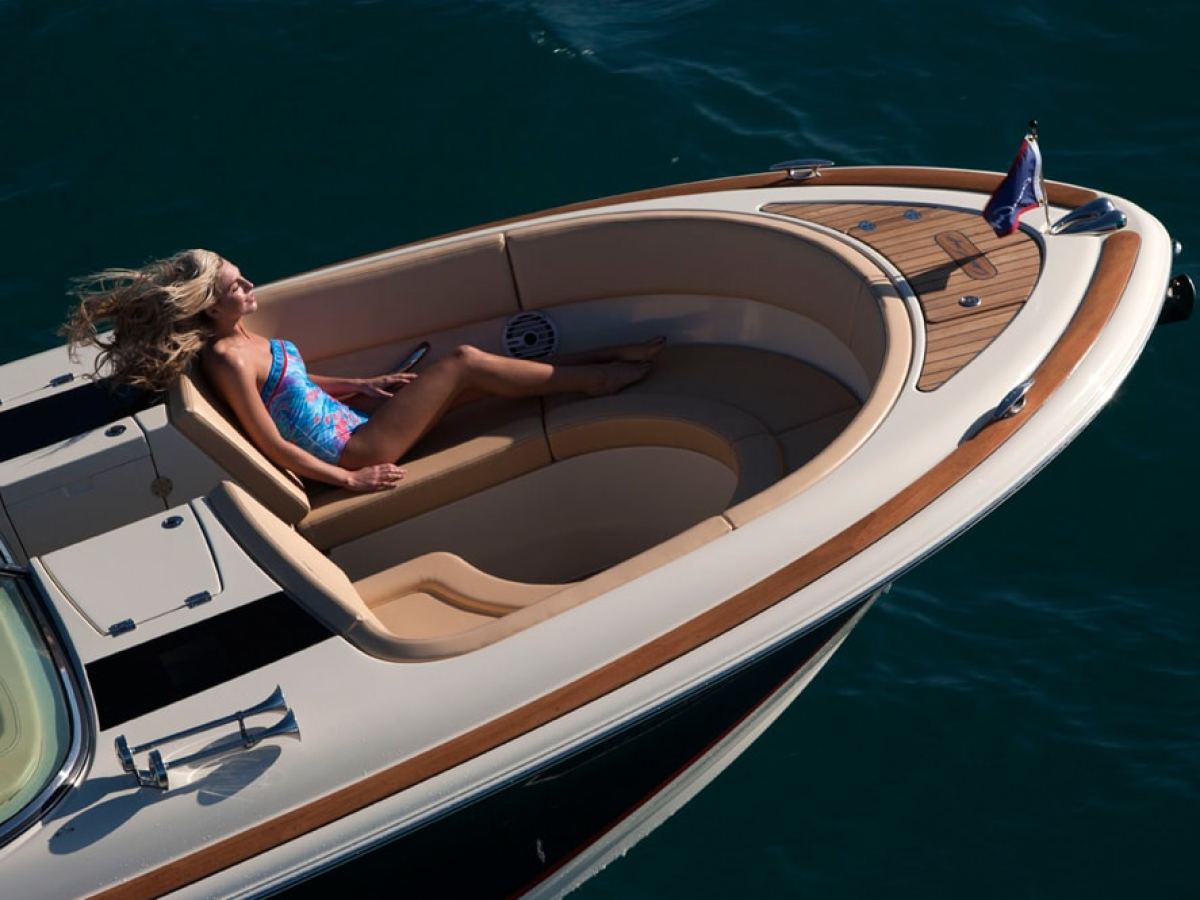 a person sitting on a boat in the water