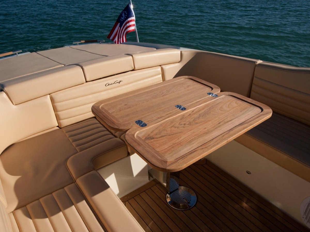 a boat sitting on top of a wooden chair