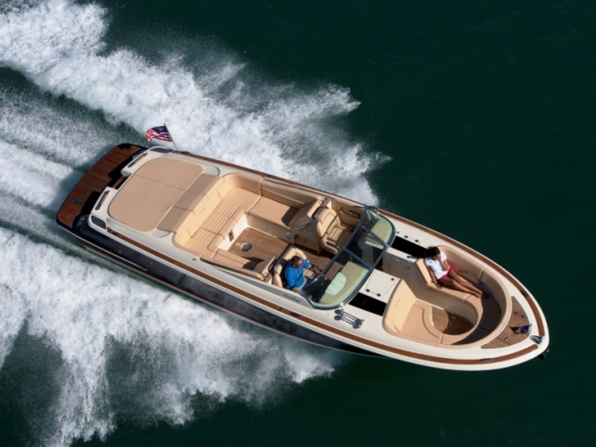 a person riding a wave on top of a boat
